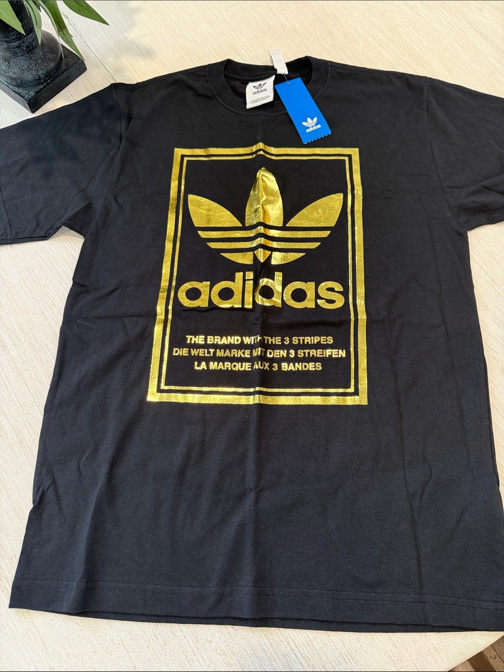 adidas Black Short Sleeve Tee with Gold Trefoil Graphic